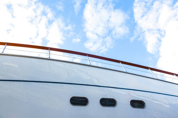istock Hull of a luxury motorized white yacht with portholes, bottom view. 1496859350