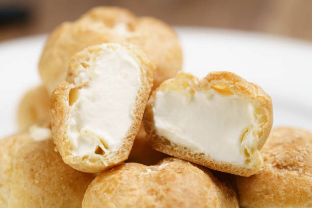 istock profiteroles on plate closeup one sliced 1496861503