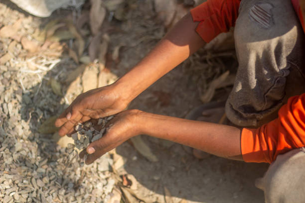 istock A man holds many bricks and stones in his fists 1496861766