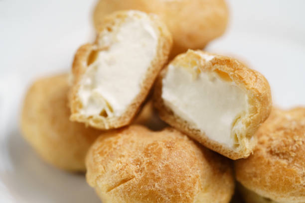 istock profiteroles on plate closeup one sliced 1496861787