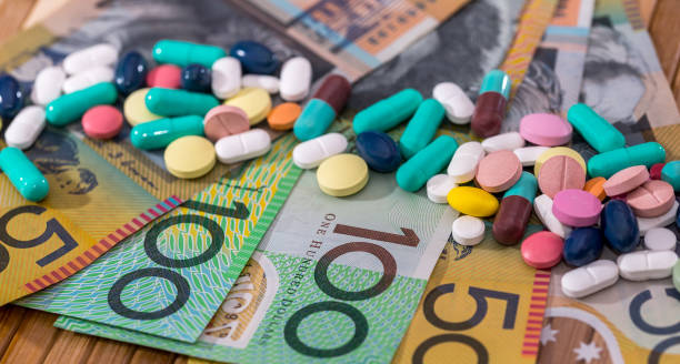istock Colourful tablets with australian dollars on wooden table 1496861790