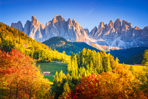Val di Funes, Italy - Autumn scenic with Santa Magdalena village, idyllic Dolomites landscape in Funes Valley, South Tyrol, Italian Alps spotlight.