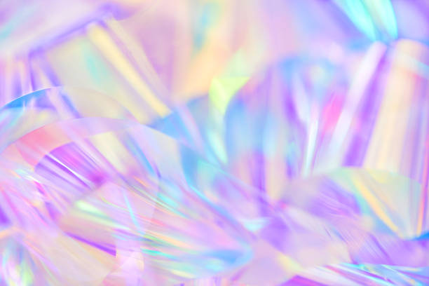 istock blurred pastel blue, purple, yellow holographic metallic foil background 1496863625