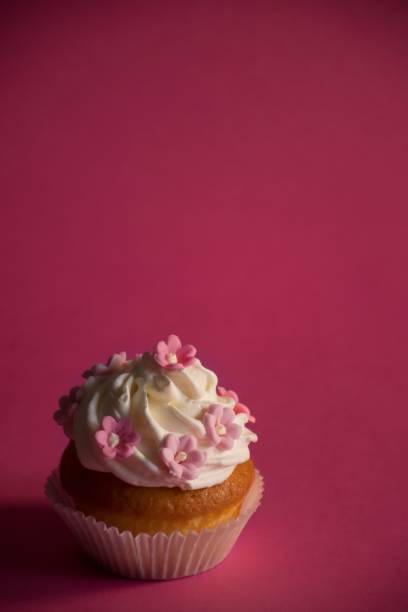 istock Closeup of cupcakes on pink background 1496863659
