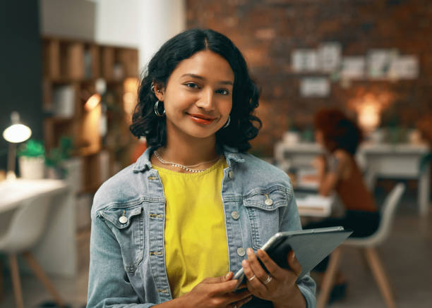 istock Face, tablet and business woman in coworking space for creative startup deadline, project or office overtime. Portrait, professional and Indian designer with digital technology for agency website 1496864849