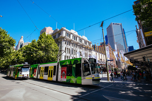 MELBOURNE, AUSTRALIA - OCTOBER 31, 2021: Trams along Swanston St near Bourke St in Melbourne, Victoria, Australia