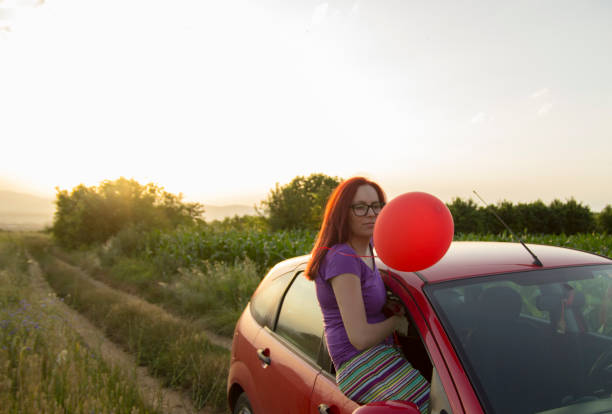 istock woman holding balloon 1496867345