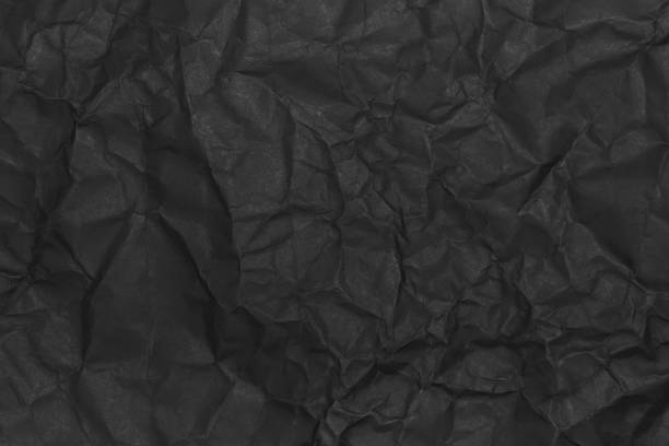 istock Black wrinkled paper texture. Grunge dark background 1496871826