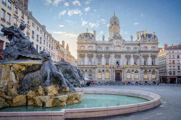 View of the fountain Bartholdi in Lyon France View of the fountain Bartholdi with the City Hall of Lyon in the Background, France bronze statue stock pictures, royalty-free photos & images