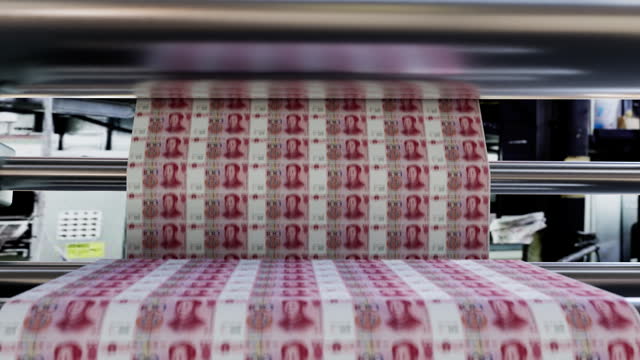 Chinese 100 Yuan Banknotes being printed with motion blur