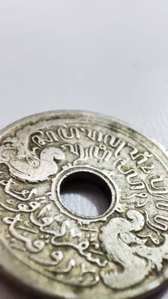 istock Old coins with a hole in the middle 1496874574