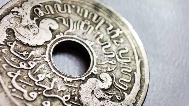 istock Old coins with a hole in the middle 1496875158