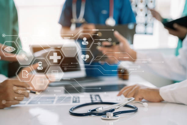 istock Medical technology concept. Doctor working with mobile phone and stethoscope and digital tablet laptop in modern office at hospital in morning light. 1496875748