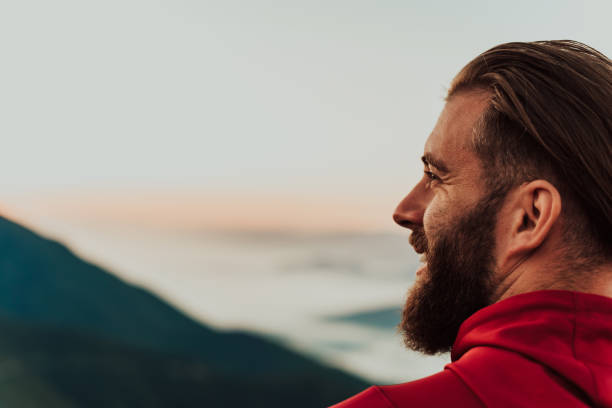istock An athlete rests on top of a mountain after exhausting running training. 1496876104