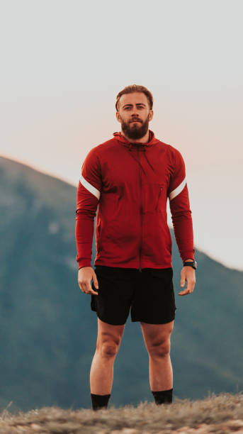istock An athlete rests on top of a mountain after exhausting running training. 1496877244