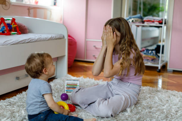 istock Brother And Sister Playing Peek-A Boo 1496877596