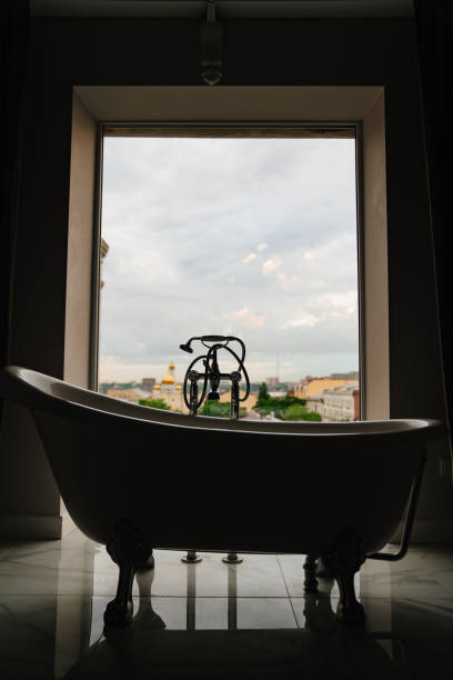 istock bathtub in front of a large window. retro-style bathroom 1496878021
