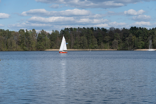 Erquy, France, September 23, 2022 - A group of young people learn catamaran sailing on the coast in the bay of Erquy, Brittany