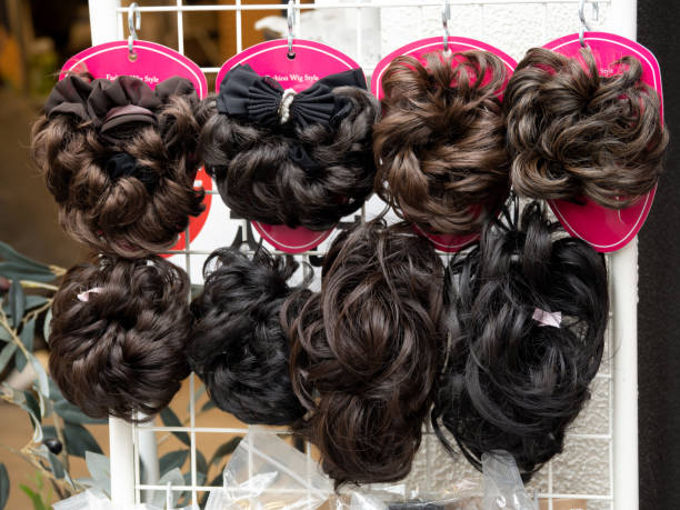 istock Wigs lined up in a store 1496881895