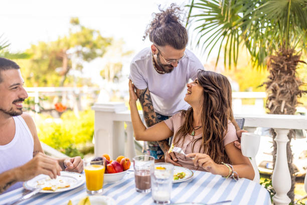 istock Happy couple having breakfast together at balcony 1496884416