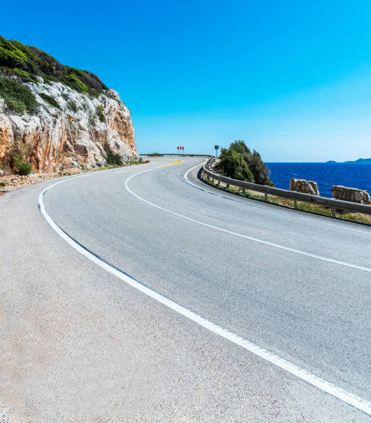 istock Winding road with sea and sky view 1496884753