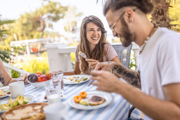 istock Happy couple having breakfast together at balcony 1496885147