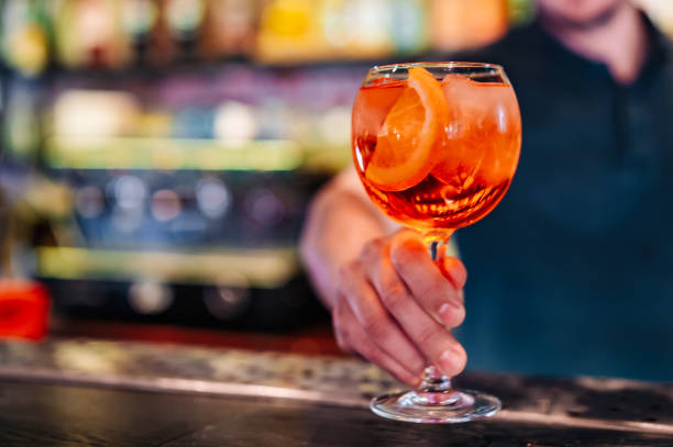 istock man hand bartender making cocktail in glass on the bar counter 1496886123