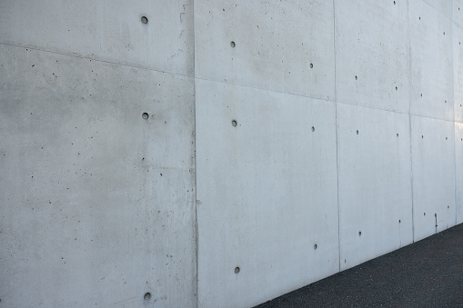 perfect concret wall outside on a sunny day with sun spots