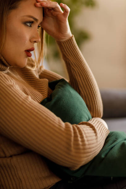 istock Frustrated young woman embracing a pillow, struggling with intrusive thoughts 1496887937