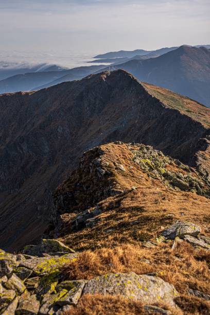 istock Steeple of a mountain with large rocks and dry grass 1496888089