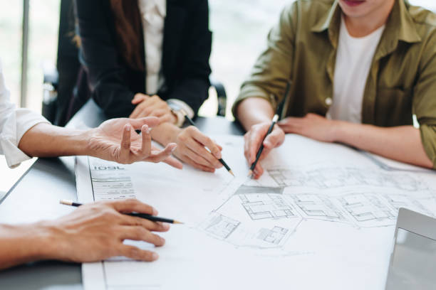 istock Engineers, designers and interior designers are finalizing the design of interiors by discussing selecting materials and colors to design rooms to present to clients. 1496888565