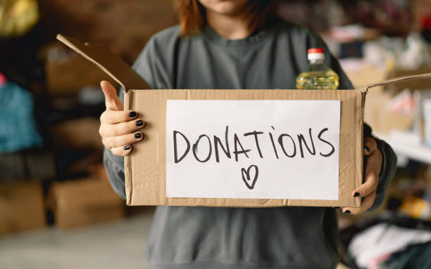 istock Volunteer teengirl preparing donation boxes for people 1496888621