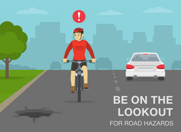 안전한 자전거 타기 규칙 및 팁. 도로 위험에 주의하십시오. 도로의 구멍을 보고 있는 자전거 타는 사람의 정면모습. - rules of the road stock illustrations