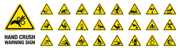 Set of 24 isolated Hand Crush Force hazardous symbols on yellow round triangle board warning sign Set of 24 isolated Hand Crush Force hazardous symbols on yellow round triangle board warning sign safety first stock illustrations