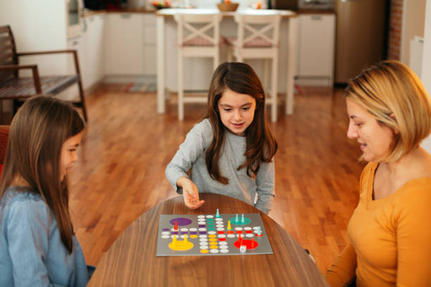 istock Family playing board game on the table 1496898448
