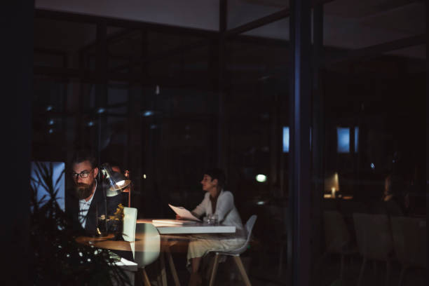 istock Overview of an office late at night 1496905835