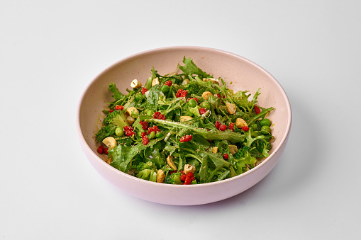 Green salad with goji berries and broccoli in a plate