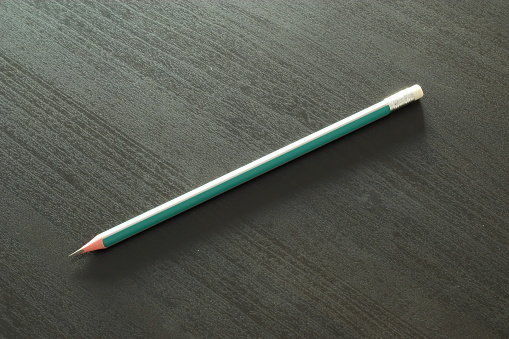 Closeup shot of a pencil on a desktop.