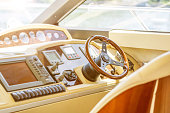 Rudder and controls of the yacht close-up.Steering wheel on yacht.