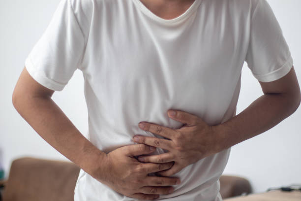 istock The man in the white shirt has a stomach ache. 1496911463