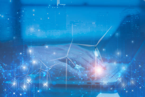 Double exposure businessman using laptop computer manage power wind turbine power control farm,digital network technology,concept technology renewable clean energy,business and industry electricity