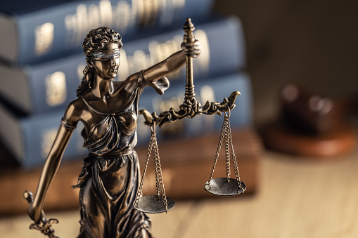 Gavel on open books. High key lighting and shallow DOF.