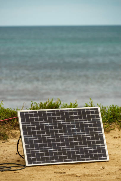 istock Solar photovoltaic panel, charging battery outdoors. 1496917751