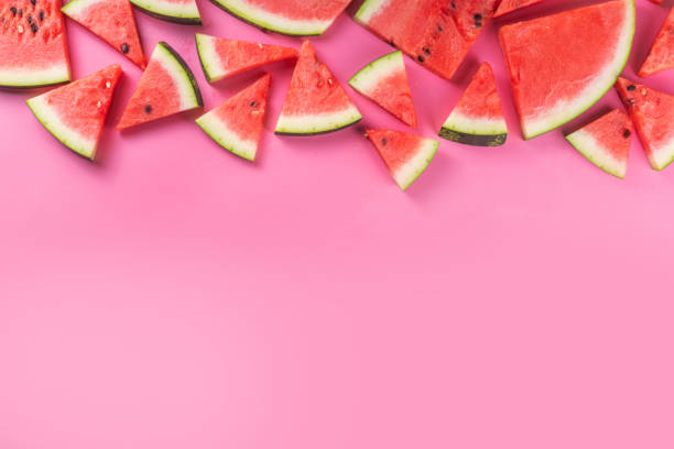 istock Sliced watermelons on pink background 1496918671