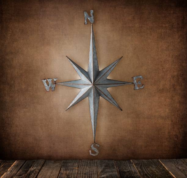 istock Metal star compass on a textured background. 1496919502