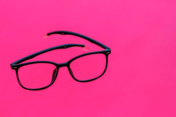 istock glasses with black frames isolated on pink 1496920412