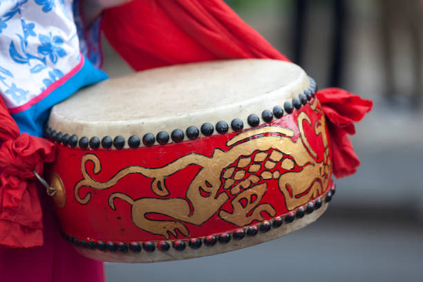Saint Denis, Reunion Island - August 07 2015: Musician playing with a Lion Drum during the Guan Di Festival.