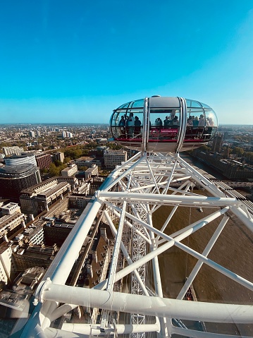 Experience the awe-inspiring beauty of London from the renowned London Eye, a towering Ferris wheel situated on the South Bank of the River Thames. These captivating images take you on a journey above the city, showcasing the panoramic vistas that unfold from the glass capsules. Witness the majestic skyline, with prominent landmarks like Big Ben, the Houses of Parliament, and the Tower Bridge standing in grandeur. From the vibrant lights of the cityscape to the serene river flowing beneath, these photographs capture the essence of London's architectural brilliance and offer a unique perspective of this global metropolis. Perfect for editorial use, travel features, or showcasing the allure of one of the world's most beloved landmarks