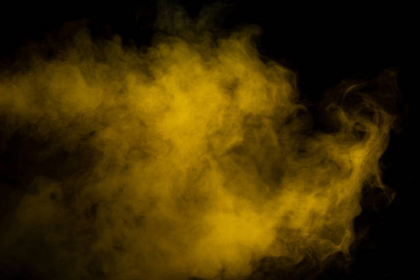 istock Yellow steam on a black background. 1496924714