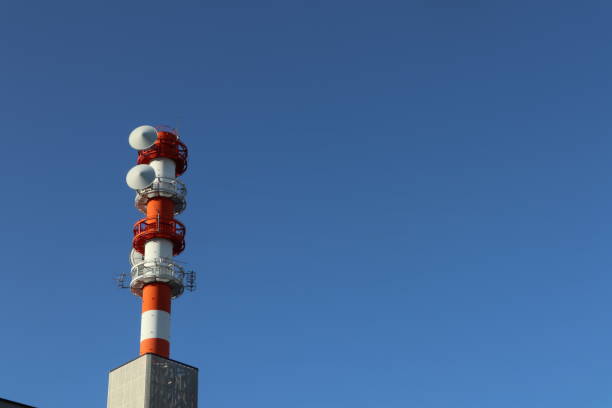 istock red and white Tower Standing Tall Against a Clear, Unblemished Sky on a Sunny Day 1496924965